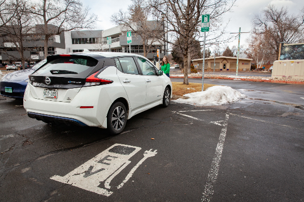An electric vehicle in an EV charging parking spot.