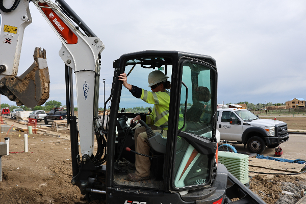 City of Fort Collins Electric Line Worker Scholarship, there is a photo of a line worker driving a crane