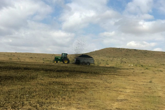 Biosolids land application with tractor