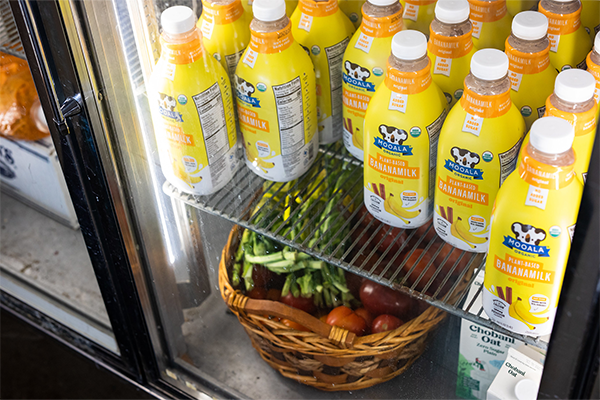 commercial refrigerator with milk and veggies