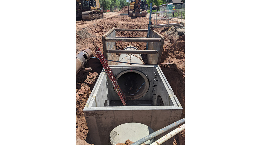 Storm pipe construction in a Fort Collins urban neighborhood street.