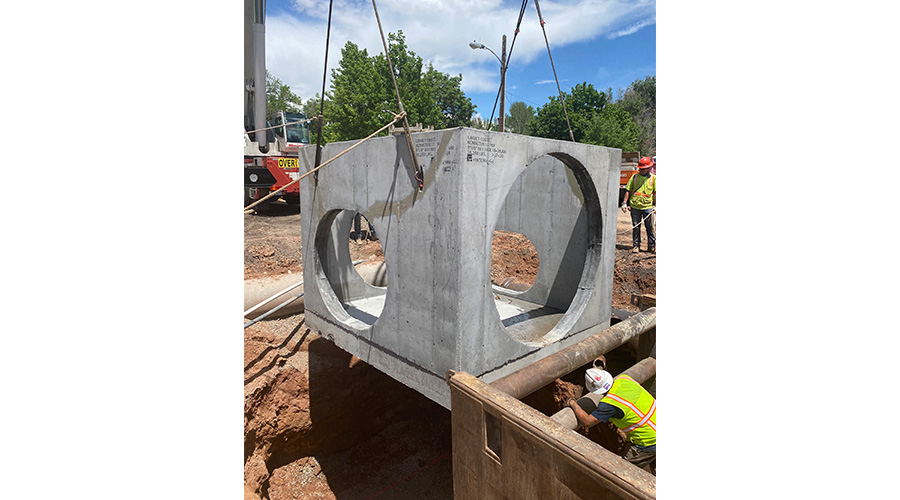 Storm structure installation in a Fort Collins urban neighborhood street.