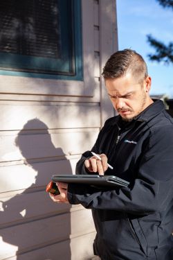 An energy advisor evaluating a home