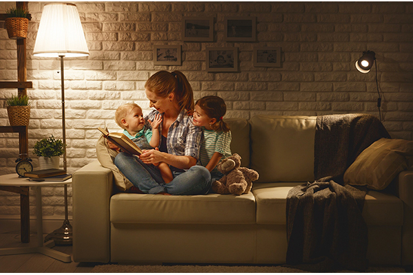 Mom and kids reading on couch