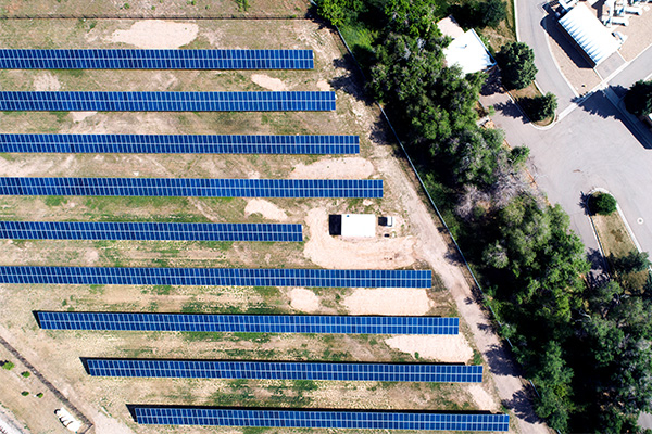 an aerial view of Riverside Community Solar Project with rows of solar panels
