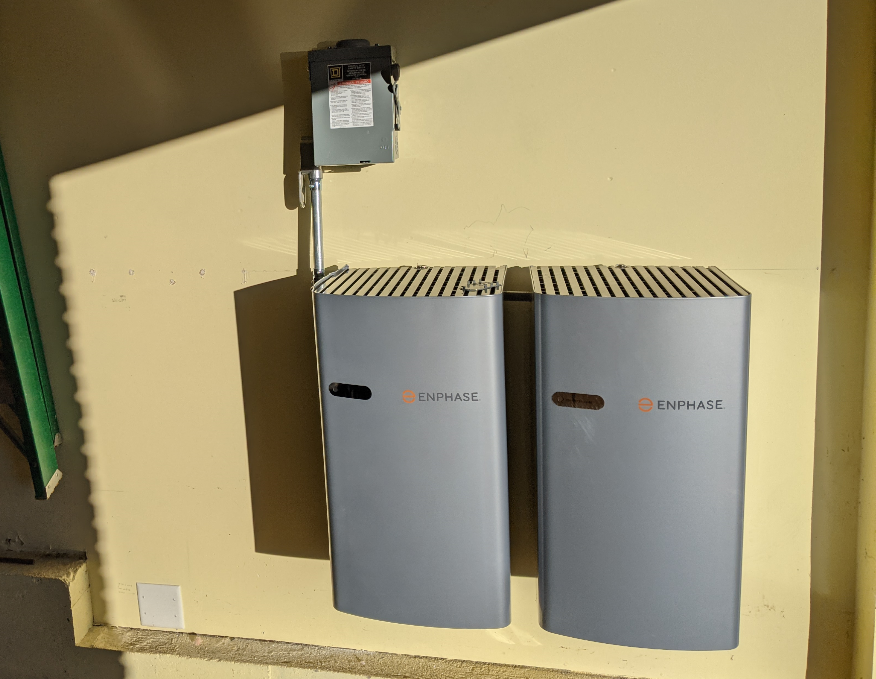 two battery storage units mounted on a wall