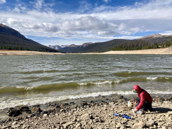 Watershed Specialist Jared Heath collecting water quality samples at Chambers Lake.