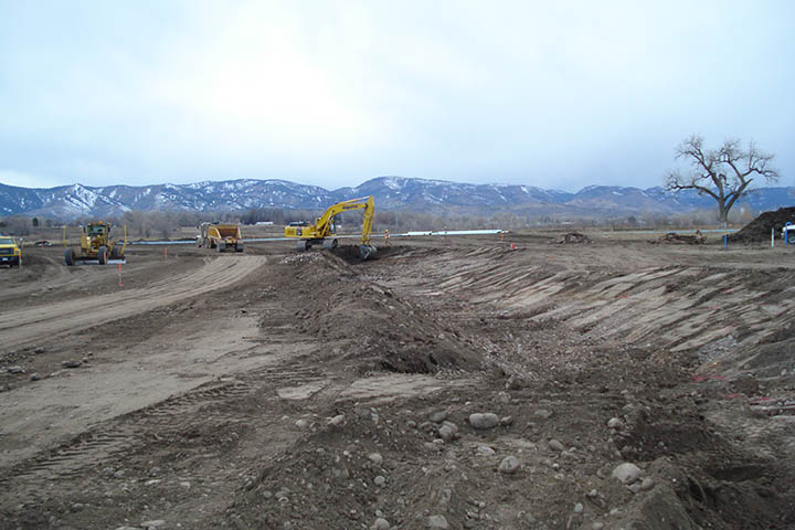 Excavation of the new outfall channel north of Vine Drive and west of Shields.