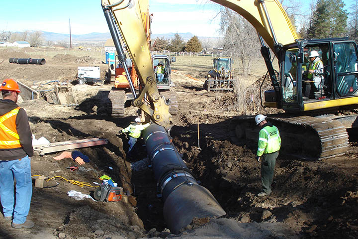 Installation of new culverts under the abandoned Colorado and Southern Railroad embankment.