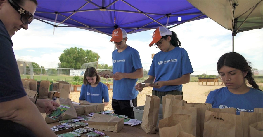 NextGenServes 2022 crew sorting seeds at the Gardens on Spring Creek