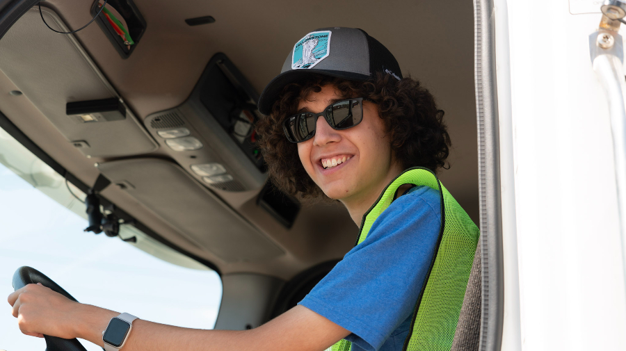 NextGenServe teen inside a snow plow