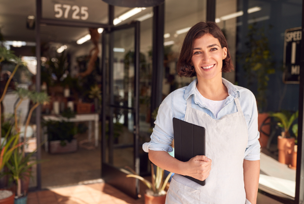 Photo of a business owner standing outside of a shop